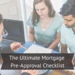 Couple reviewing mortgage documents with a loan officer during a pre-approval meeting.